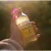 Hand Holding Lemon Beverage