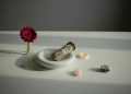 Incense on a White Plate, Crystals and a Gerbera Flower on a Table