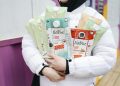 Person Holding Milk Carton