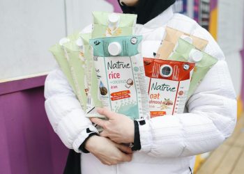 Person Holding Milk Carton