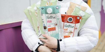 Person Holding Milk Carton