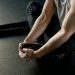 Strong Man Sitting on the Floor Stretching