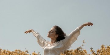 Woman At A Flower Field