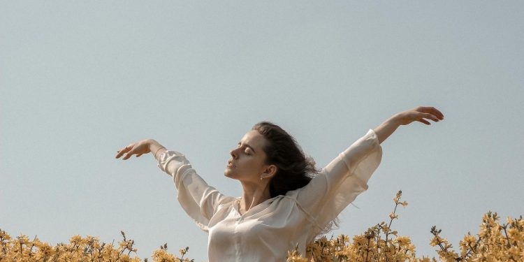 Woman At A Flower Field