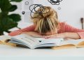 Woman Putting Her Head Down on the Desk