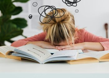 Woman Putting Her Head Down on the Desk