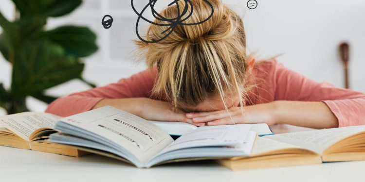 Woman Putting Her Head Down on the Desk