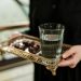 Glass of Water in a Metallic Serving Tray