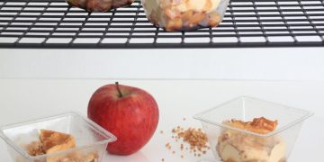An Apple Near Parfait in Plastic Containers